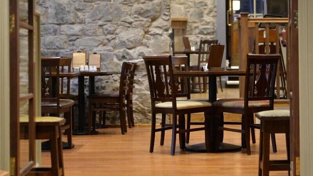 A dining area with stone walls, wooden tables, and chairs. - The Portree Hotel (Portree)