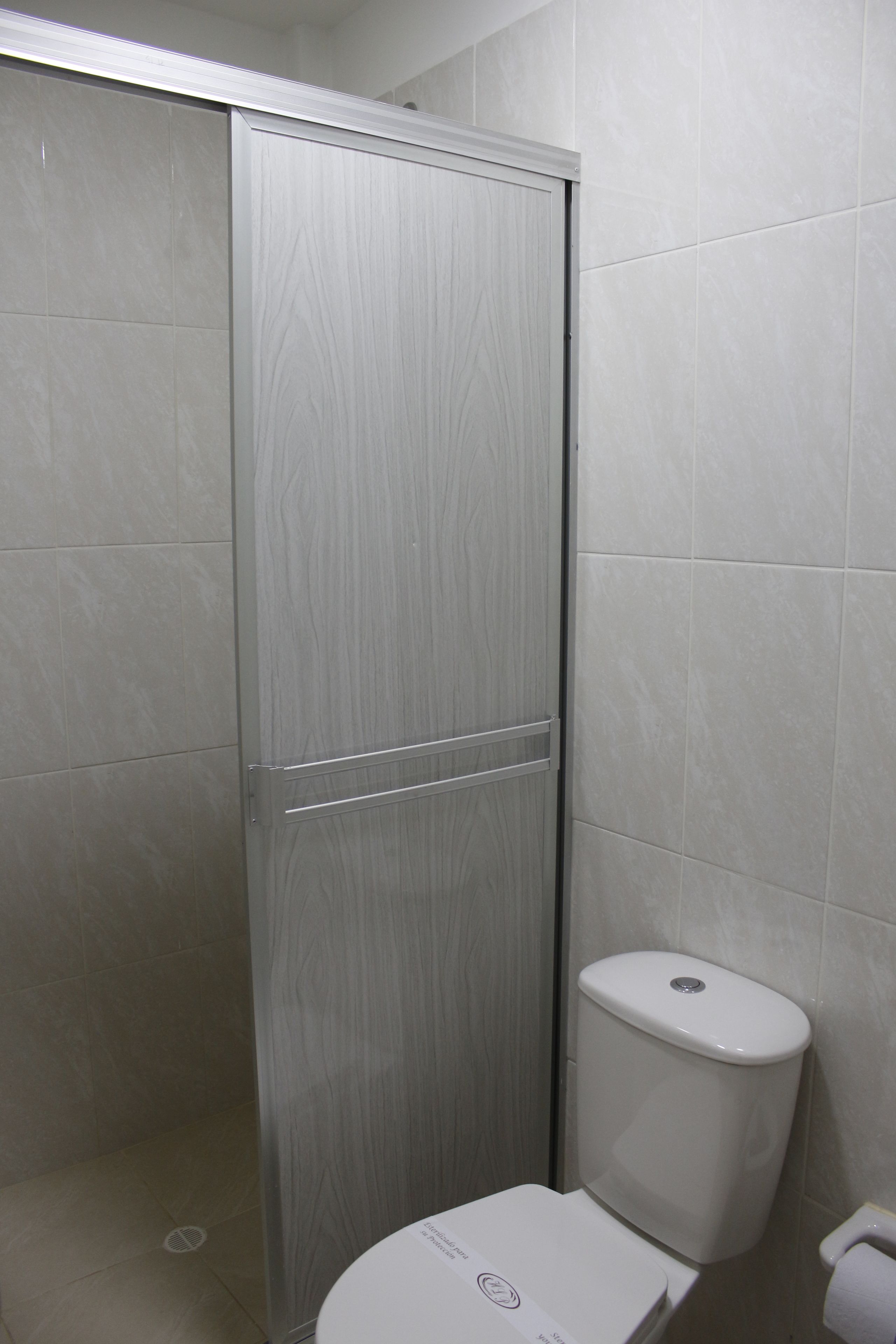 shower, rainfall showerhead, hair dryer, towels