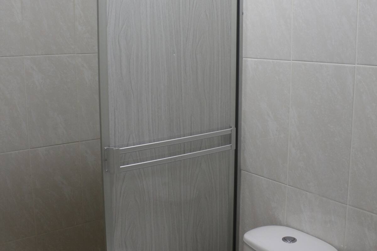 shower, rainfall showerhead, hair dryer, towels