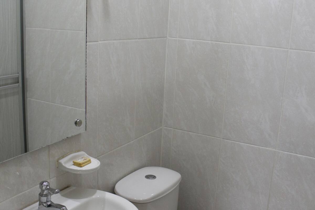 shower, rainfall showerhead, hair dryer, towels