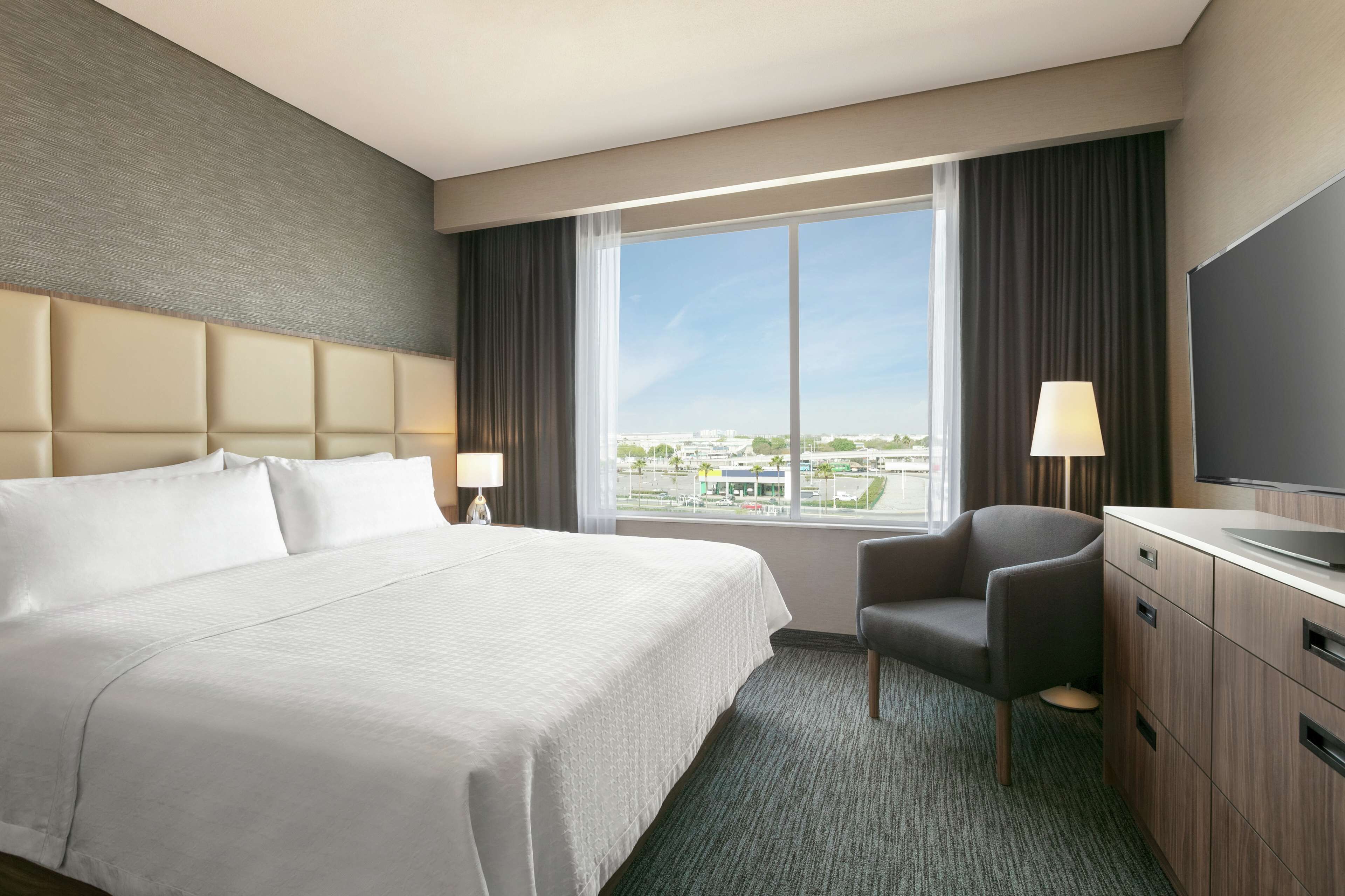 suite, 1 bedroom, non smoking | in-room safe, desk, blackout curtains, iron/ironing board