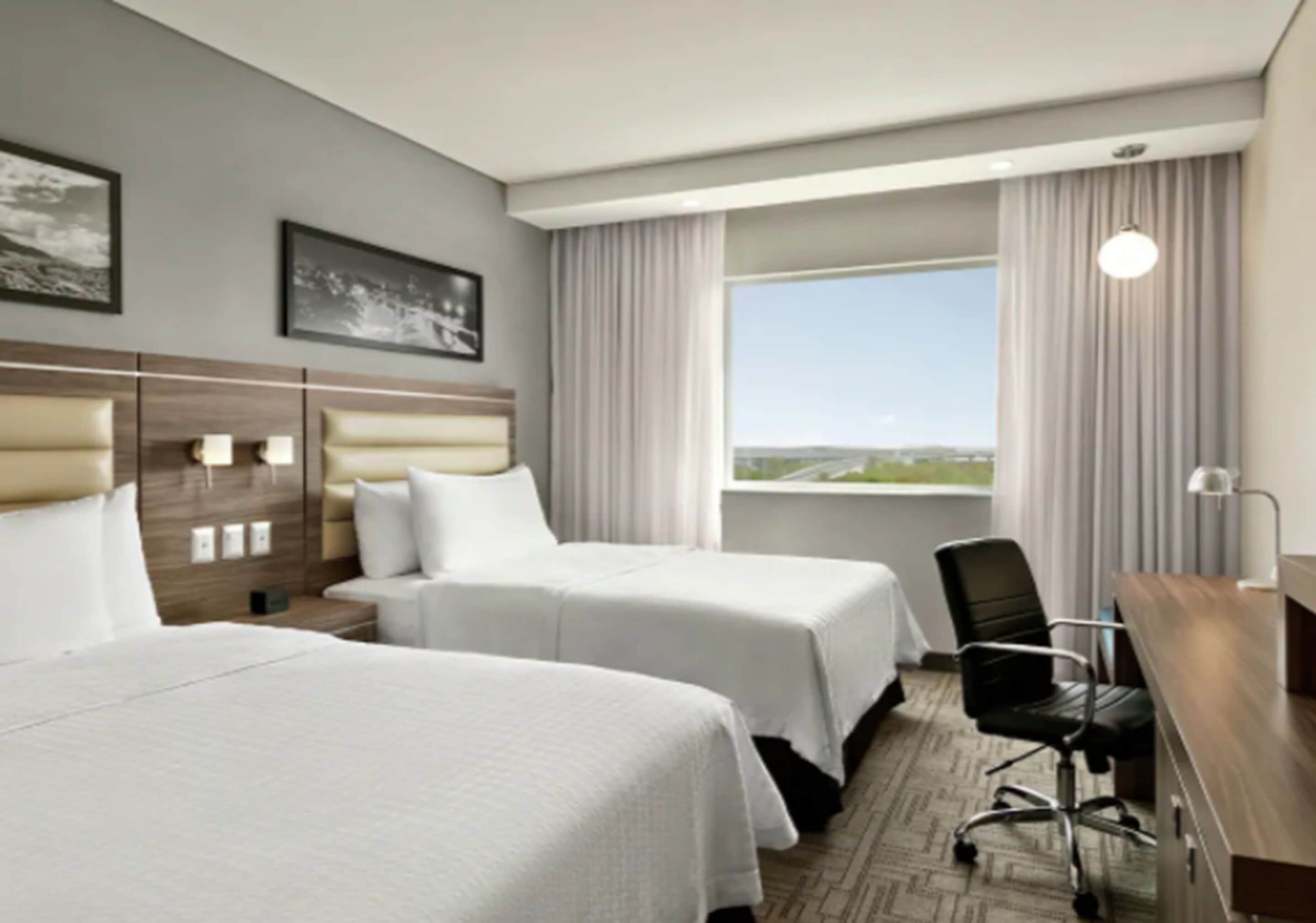 room, 2 double beds, refrigerator | in-room safe, desk, iron/ironing board, free wifi