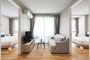 Two Bedroom Suite | Living area | 49-inch Smart TV with satellite channels, TV - Diamond Resort Phuket Official Account (Choeng Thale)