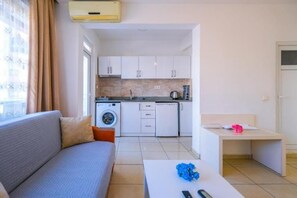 Familienapartment, Balkon | Wohnbereich | LCD-Fernseher, Fußbodenheizung