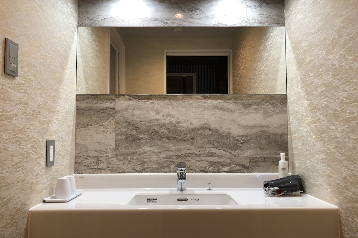 luxury suite | bathroom | separate bathtub and shower, deep-soaking bathtub, free toiletries