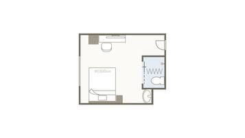 A floor plan of a hotel room with a bed, a desk, a bathroom, and a window.