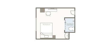 A floor plan of a hotel room with a bed, a desk, a bathroom, and a window.