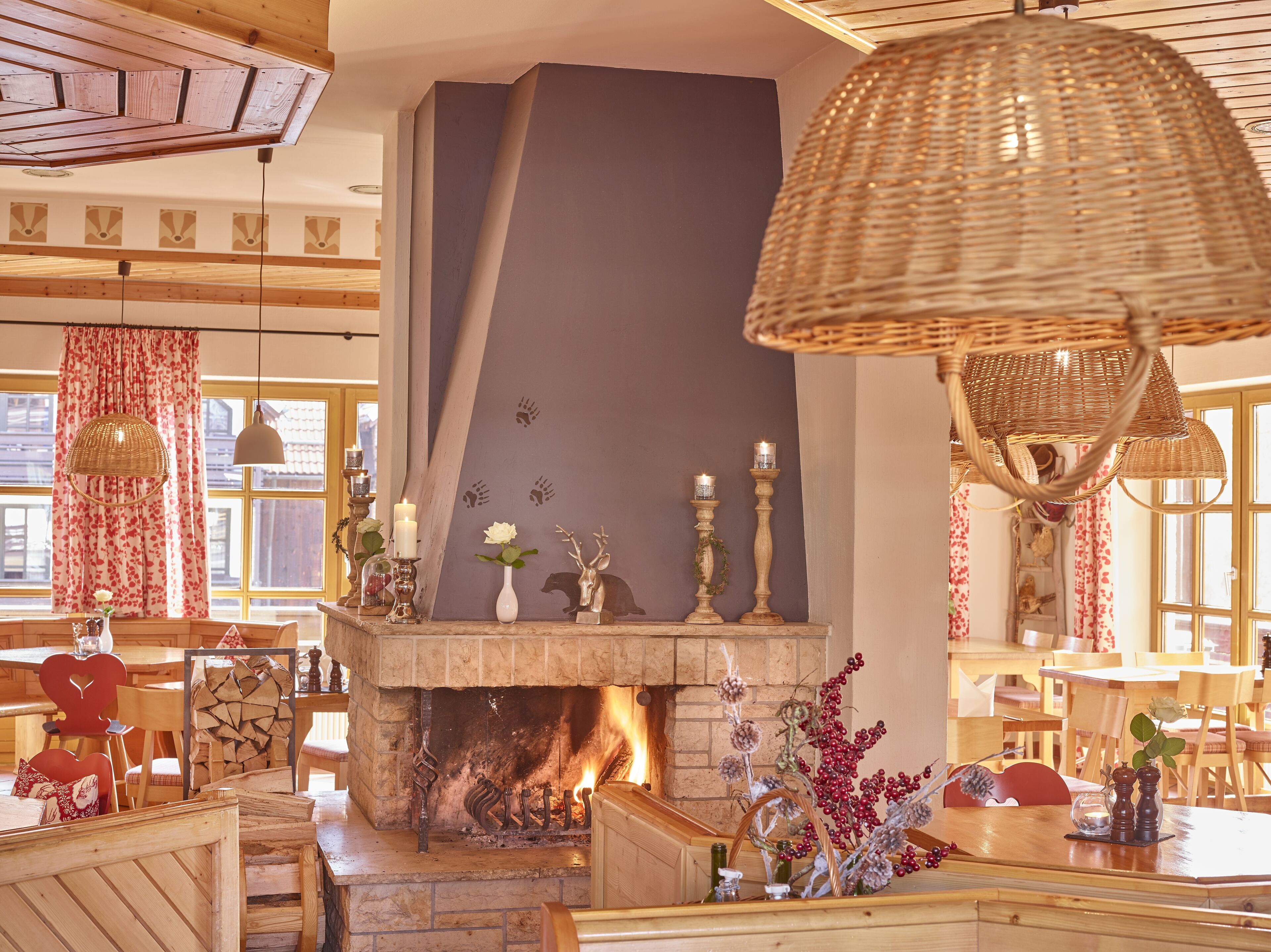 A cozy interior with a fireplace, wooden furniture, and decorative items.