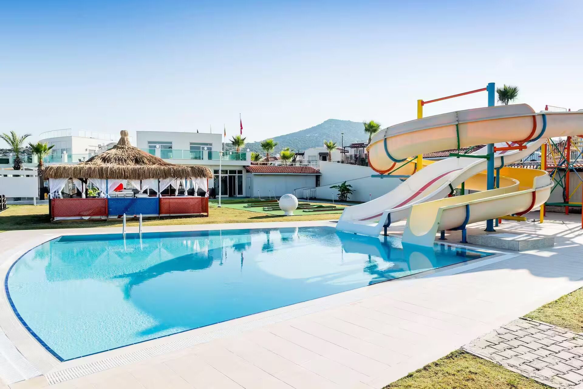 7 outdoor pools, open 9:00 AM to 7:00 PM, pool umbrellas, sun loungers