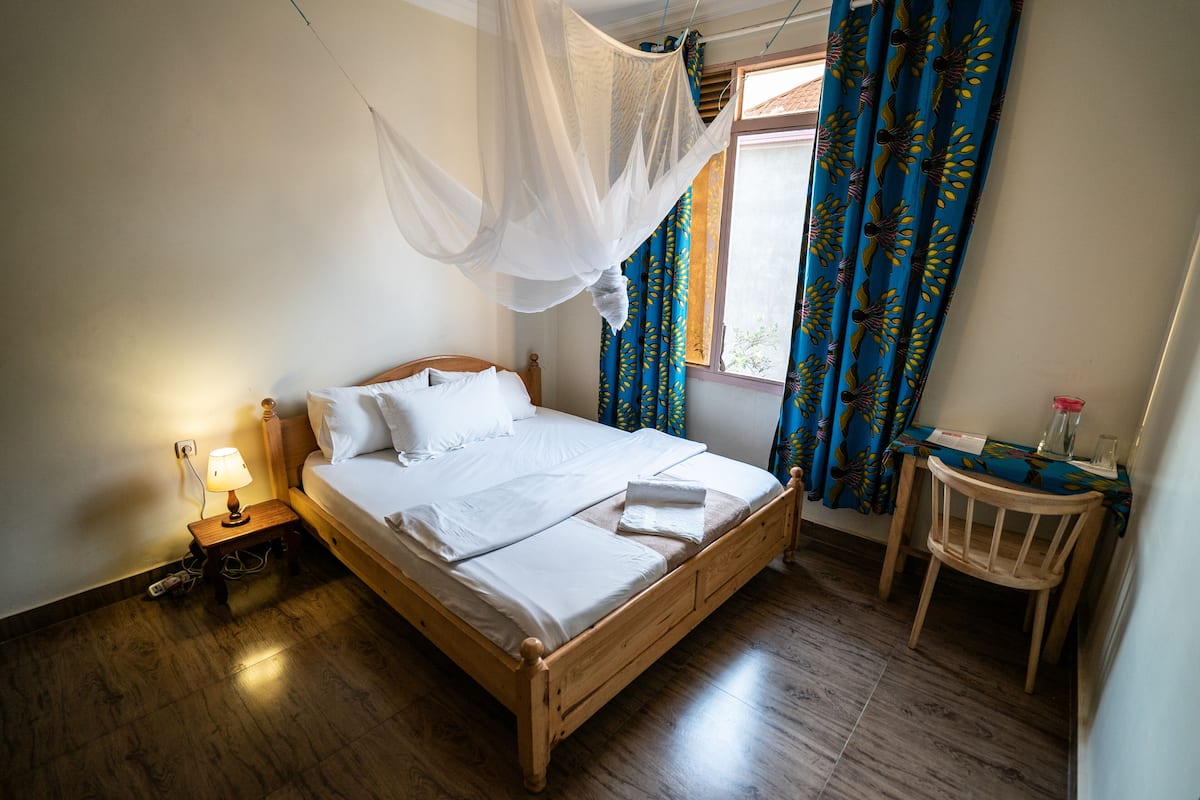 Premium bedding, desk, laptop workspace, iron/ironing board