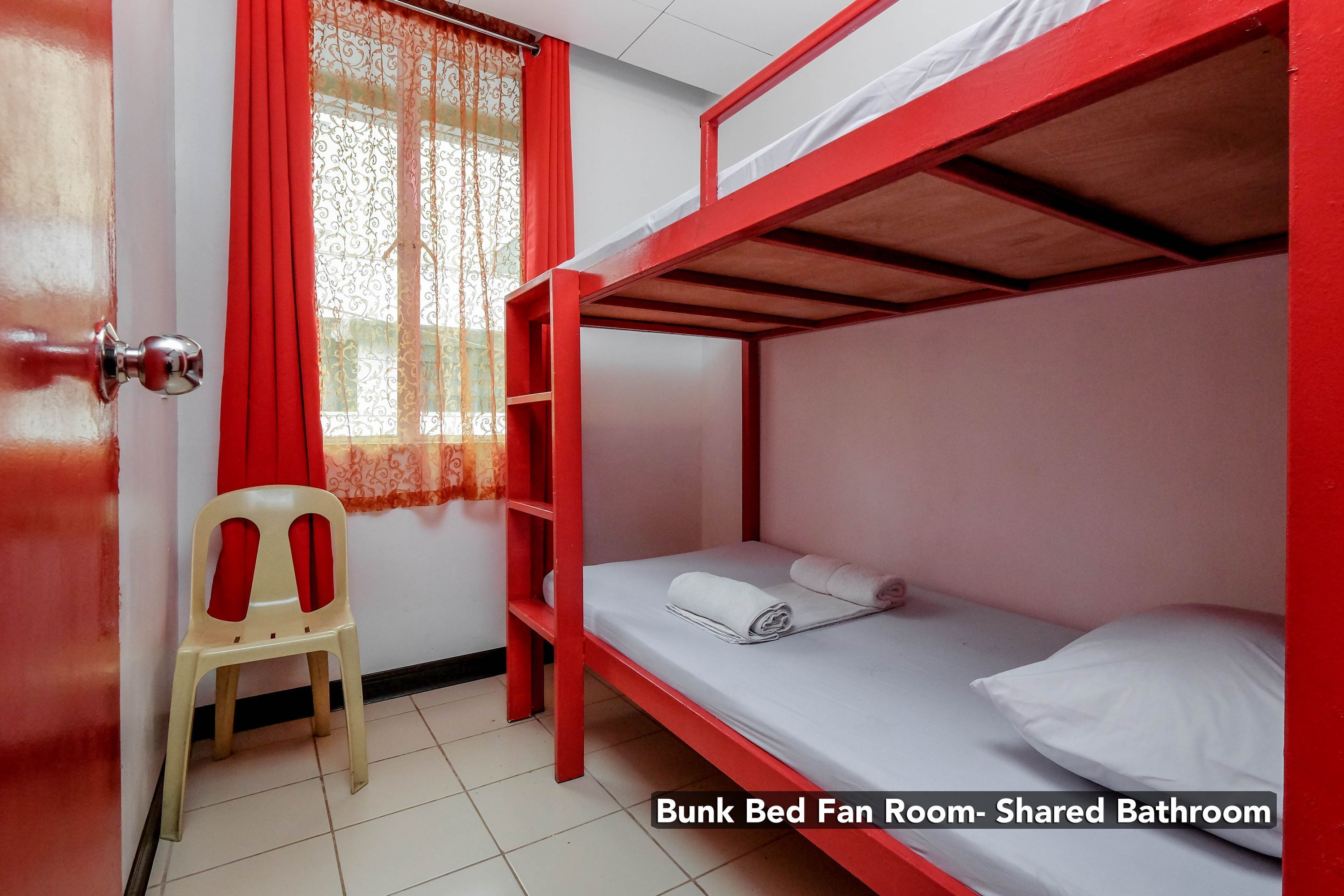 A bunk bed room with a shared bathroom.