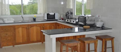 Apartment, 2 Bedrooms | Private kitchenette | Full-sized fridge, microwave, stovetop, electric kettle