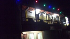 A two-story building with a visible ground floor entrance and upper floor windows. - Azmiry Residential Hotel (Kushtia)