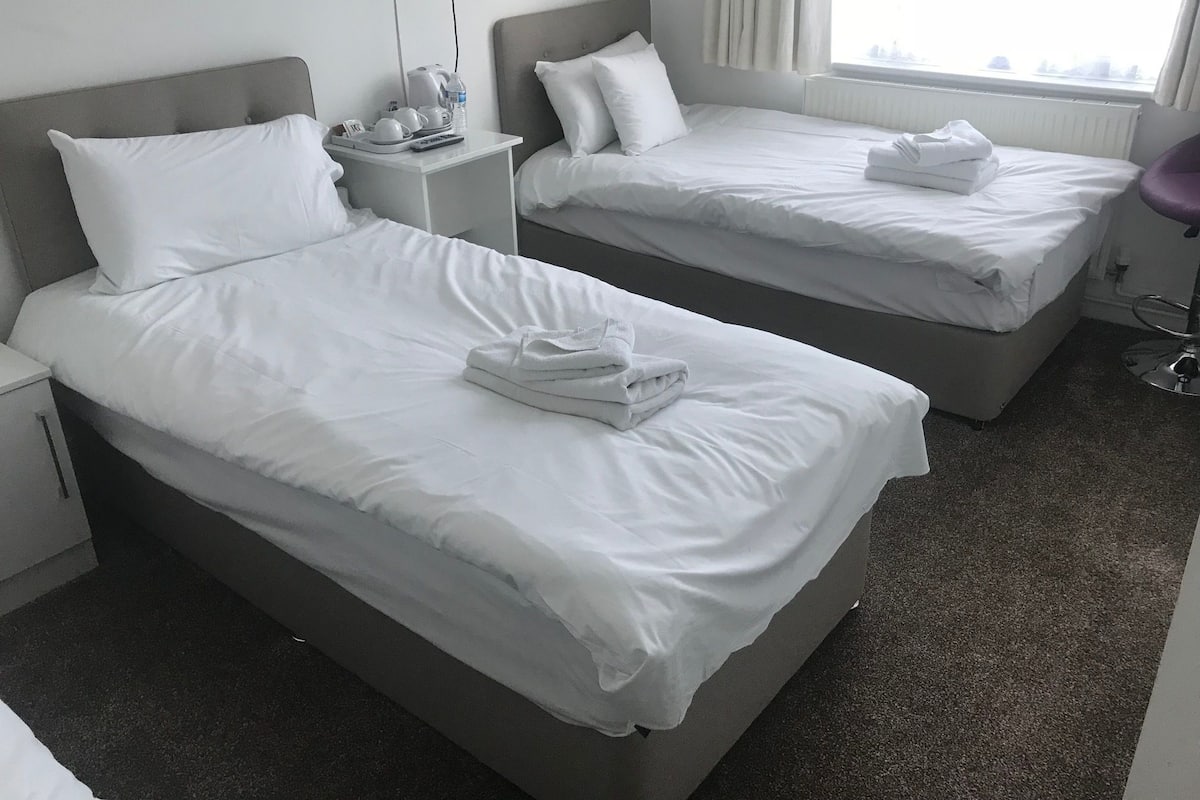 Family Room (6) | Premium bedding, desk, laptop workspace, iron/ironing board