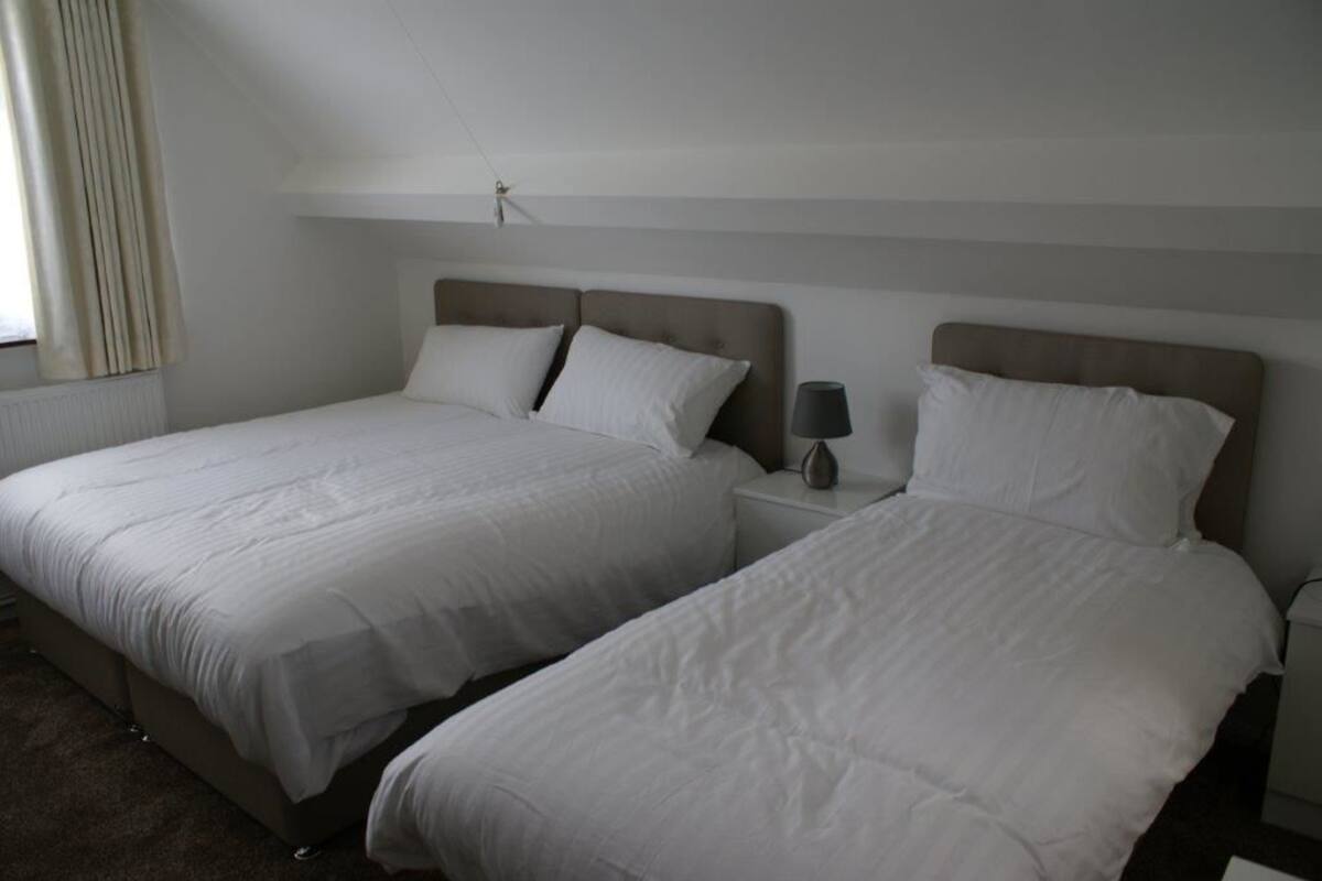 family room (12) | premium bedding, desk, laptop workspace, iron/ironing board