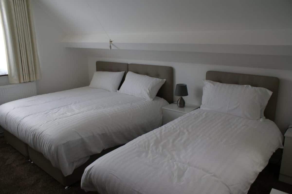 Family Room (12) | Premium bedding, desk, laptop workspace, iron/ironing board