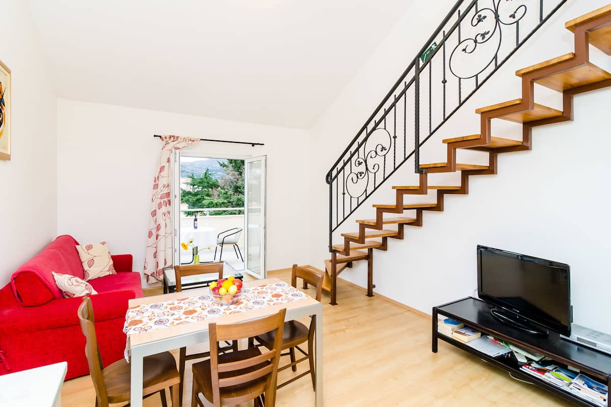 City Apartment, 1 Bedroom, Balcony (A1) | Living area | 82-cm flat-screen TV with satellite channels, TV