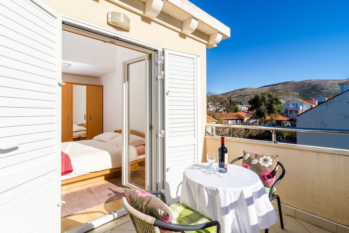 Apartment, Balcony, City View (A3) | Living area | 82-cm flat-screen TV with satellite channels, TV