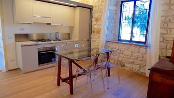 Apartemen Klasik, 1 kamar tidur | Area keluarga | TV