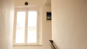 A staircase with colorful steps leading to a landing. - Fonte Gaia Experience B&B (Siena)