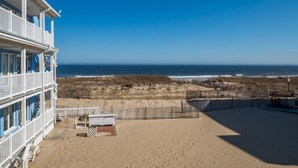 A beachfront property with a balcony overlooking the ocean. - Oceanfront condos with 3 night minimum rentals and linens included! (Ocean City)