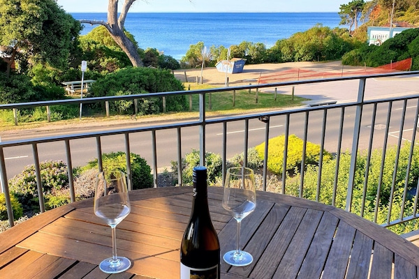 View from balcony upstairs. Has outdoor furniture with Weber BBQ.