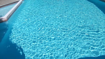 Seasonal outdoor pool, open 8:00 AM to 8:00 PM, pool umbrellas