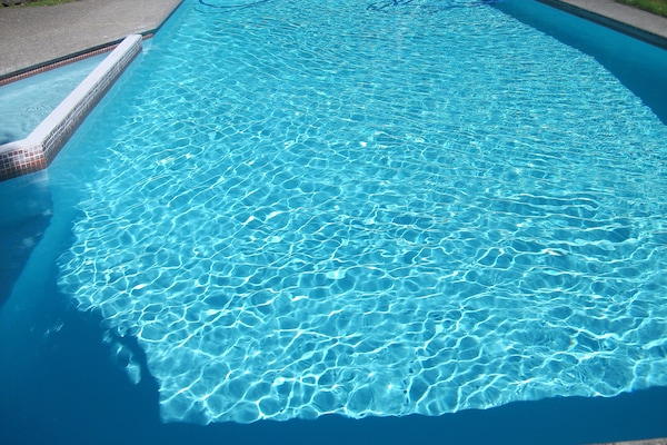 Seasonal outdoor pool, open 8:00 AM to 8:00 PM, pool umbrellas