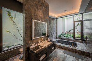 A modern bathroom with a large mirror, a double sink, and a large window with a view of greenery. - Green Palm (Yuanlin)