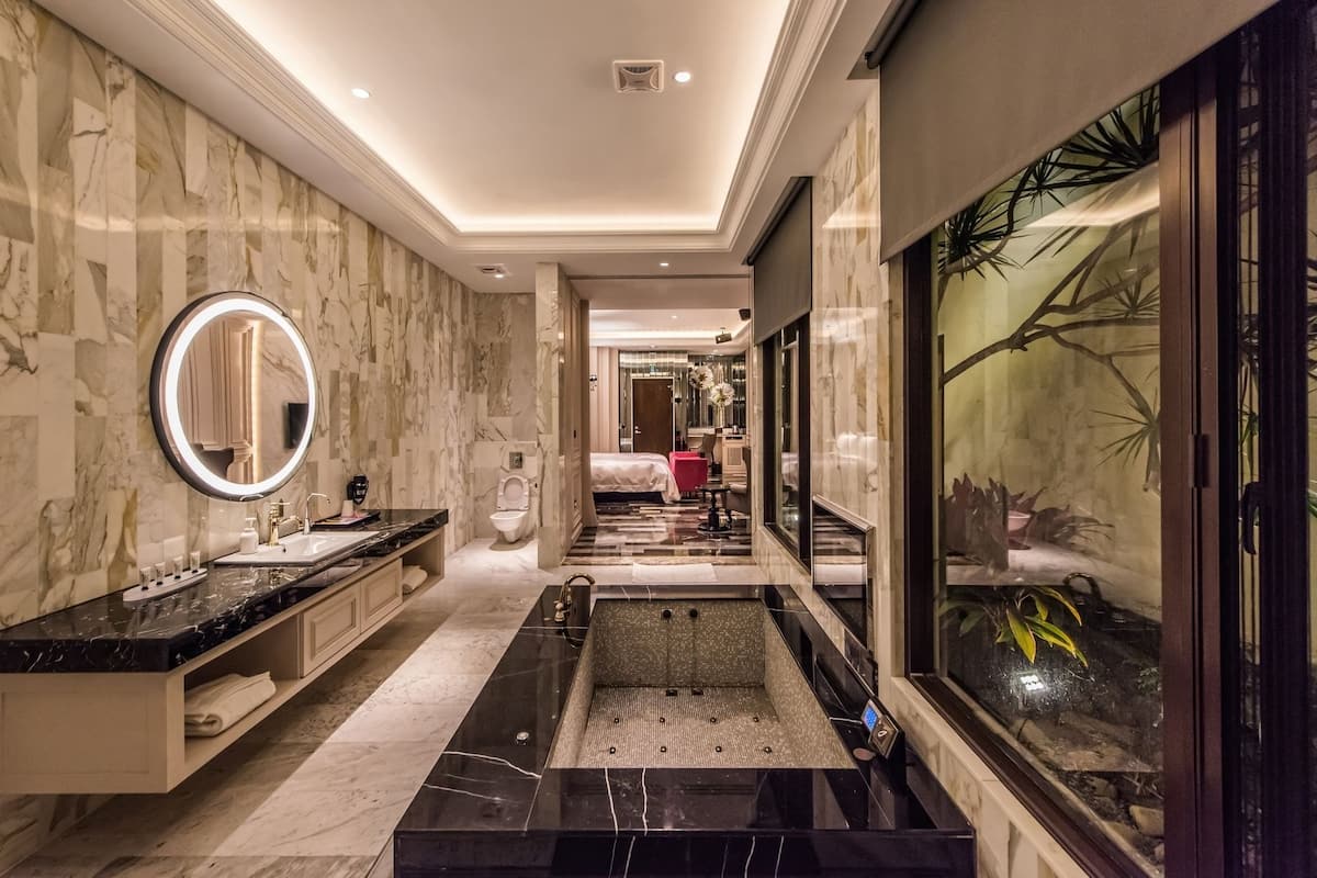 separate bathtub and shower, deep-soaking bathtub, designer toiletries