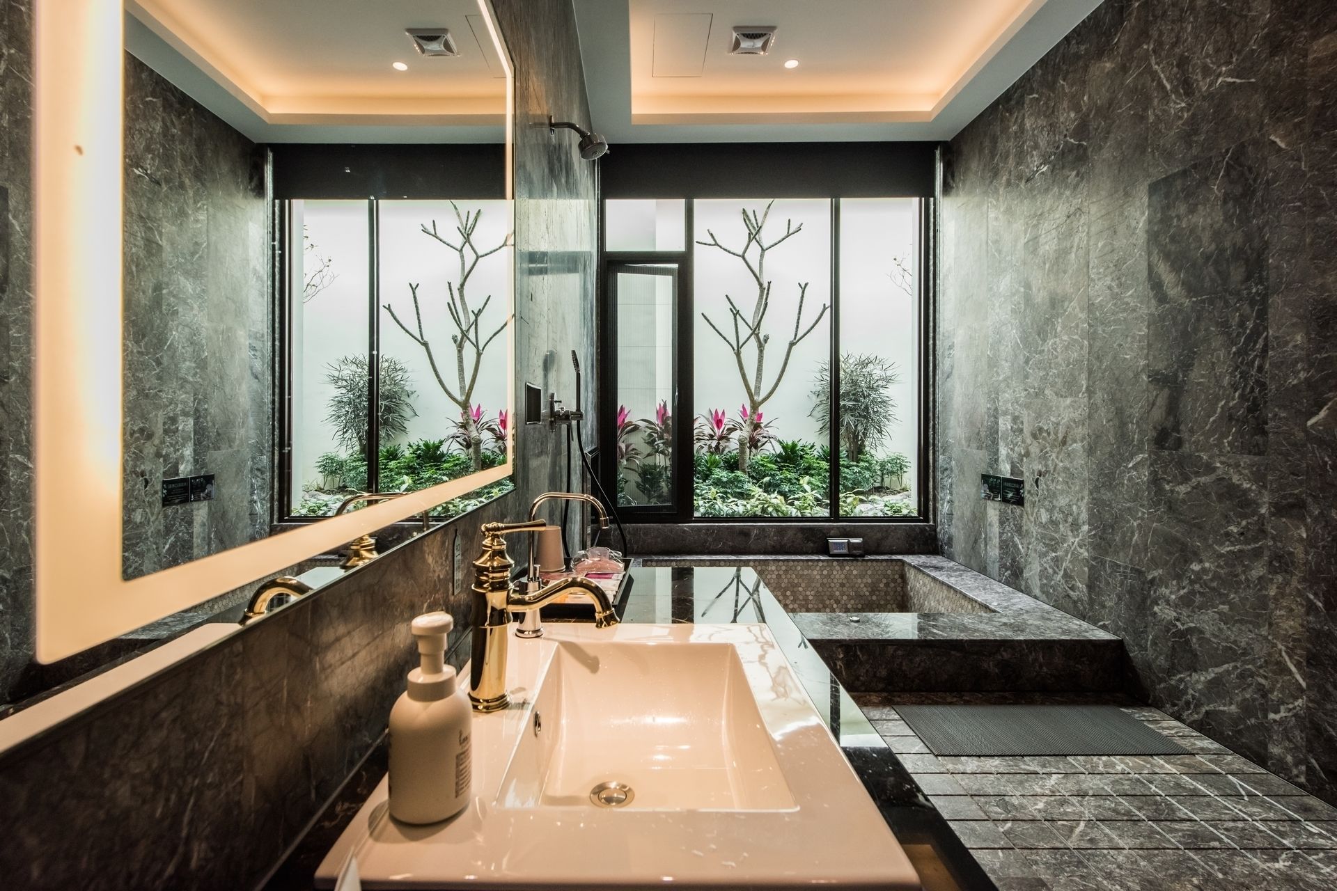 separate bathtub and shower, deep-soaking bathtub, designer toiletries