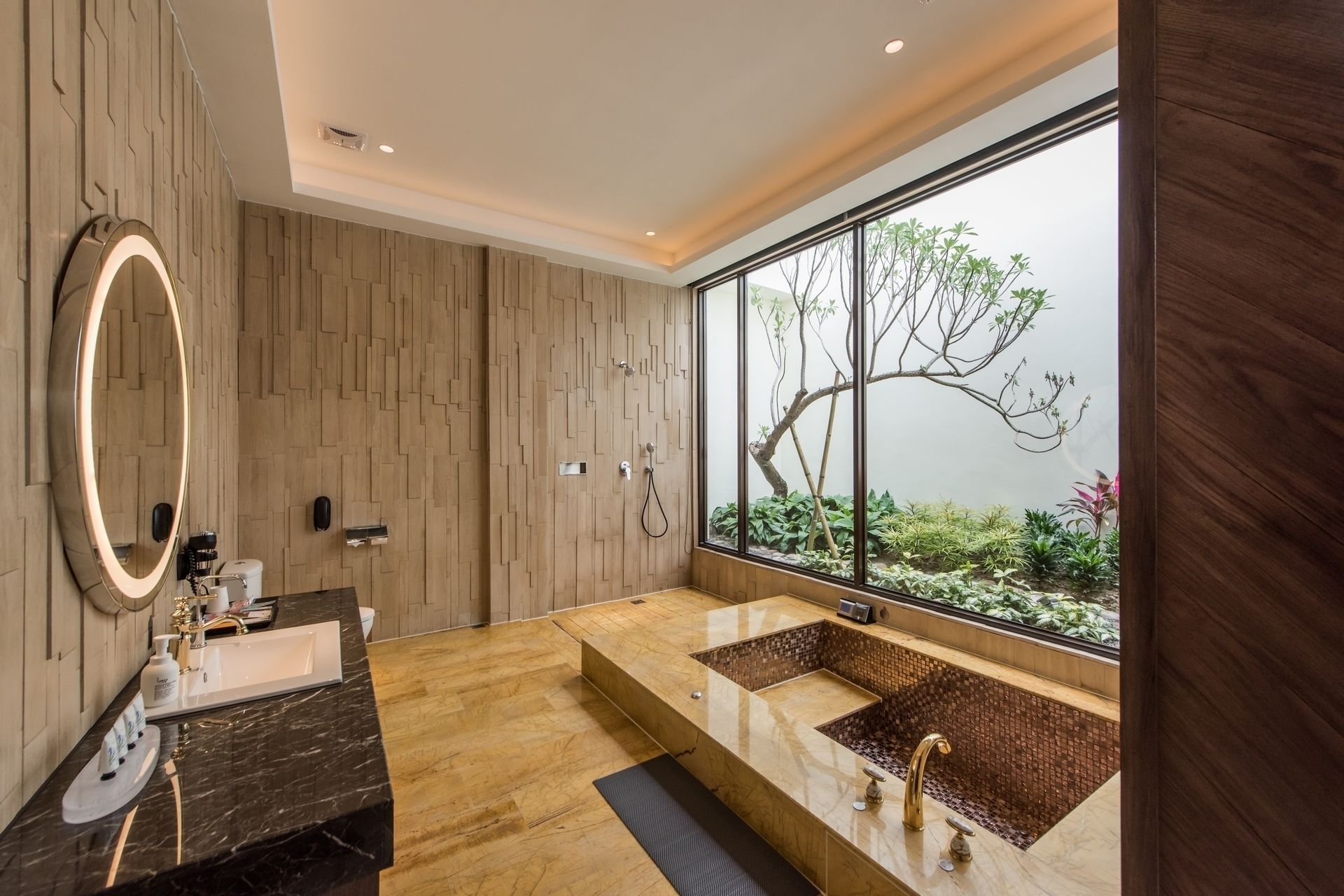 separate bathtub and shower, deep-soaking bathtub, designer toiletries