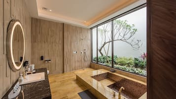 Separate bathtub and shower, deep-soaking bathtub, designer toiletries