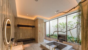 A modern bathroom with a large mirror, a built-in sink, and a window with a view of greenery. - Green Palm (Yuanlin)