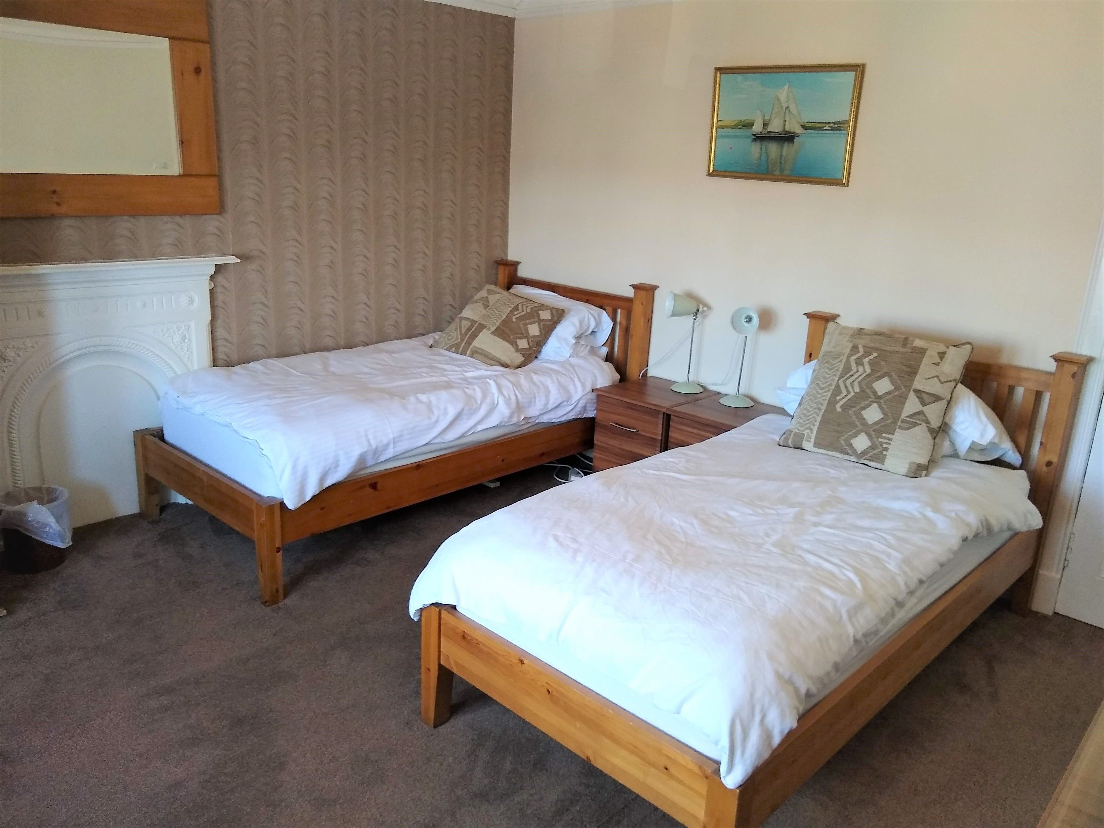 twin room, 2 single beds, shared bathroom | 1 bedroom, premium bedding, laptop workspace, iron/ironing board