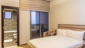 Desk, laptop workspace, bed sheets