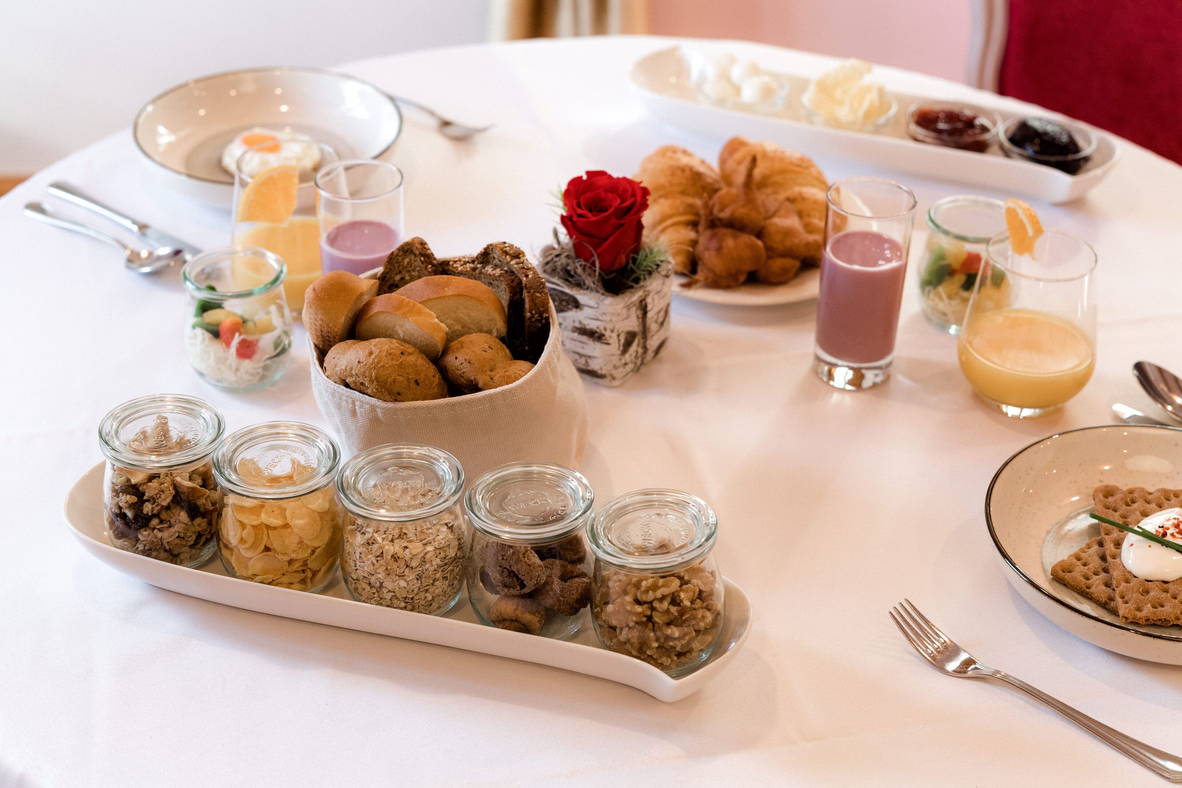 A breakfast buffet with various food items and drinks.