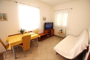 Standard Apartment, 1 Bedroom, Ground Floor | Living area | 43-inch flat-screen TV with satellite channels, TV