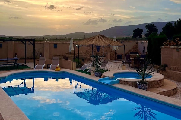 Outdoor pool, open 9:00 AM to 10:00 PM, pool umbrellas, pool loungers