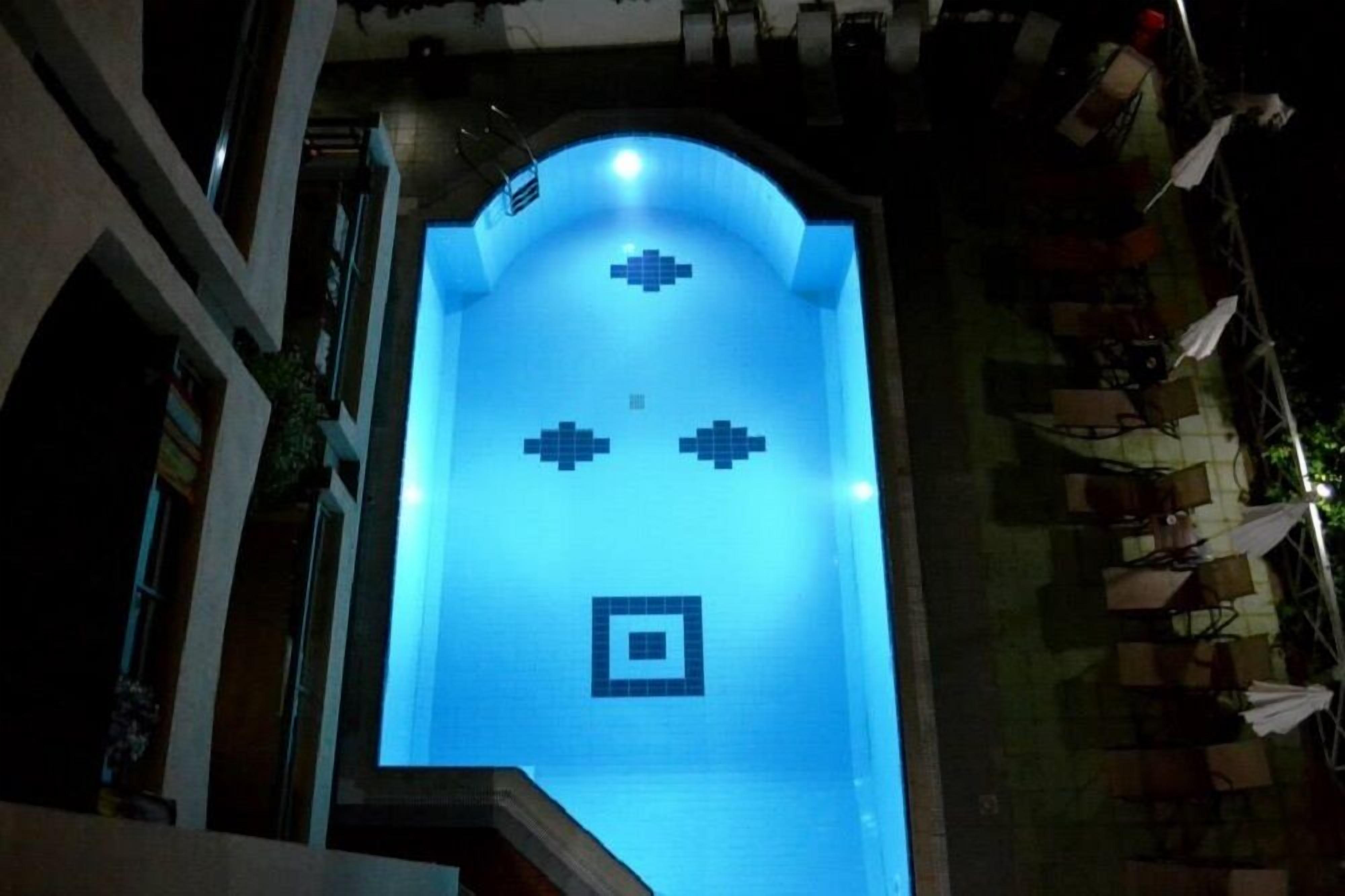 seasonal outdoor pool, pool umbrellas, pool loungers