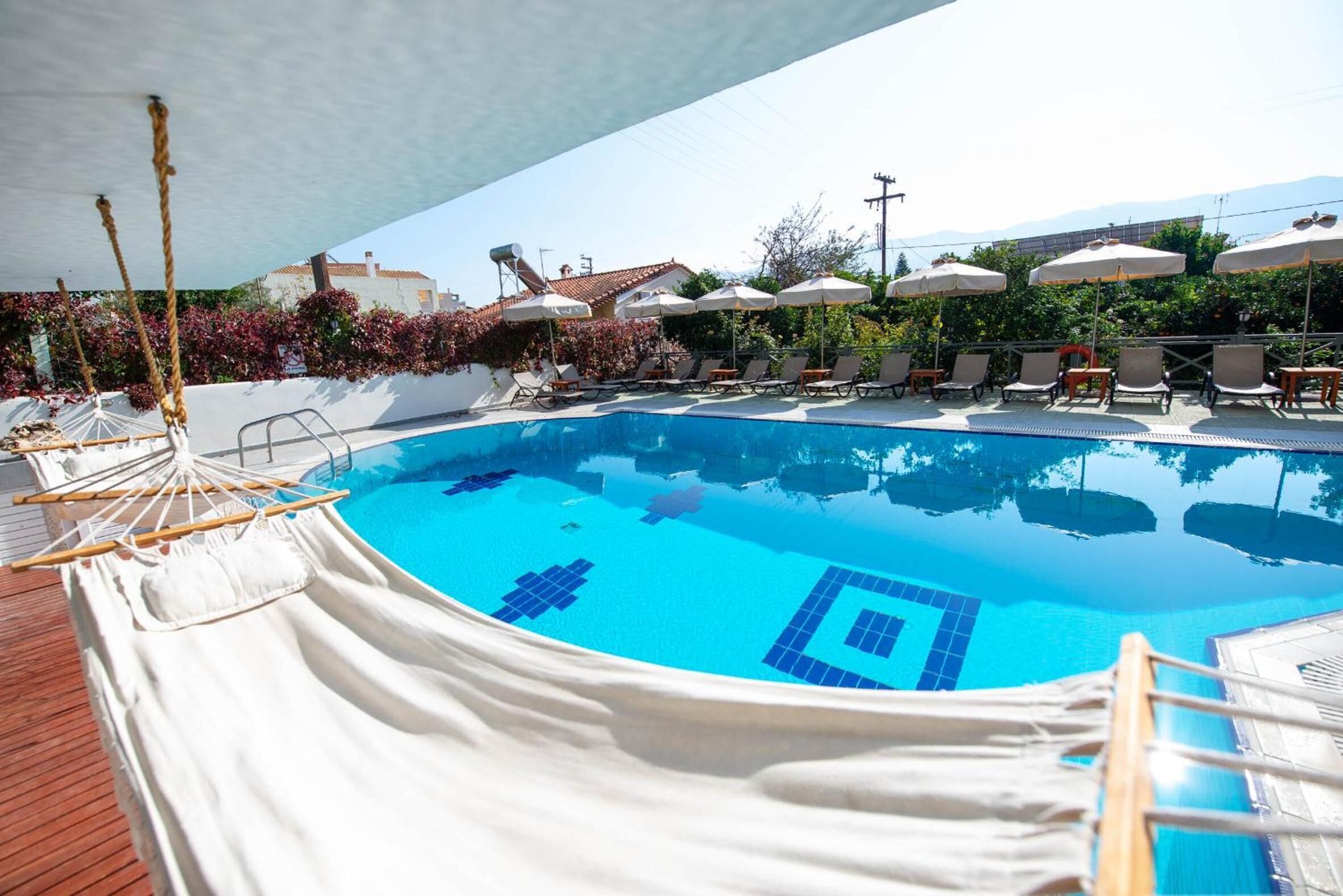 seasonal outdoor pool, pool umbrellas, pool loungers