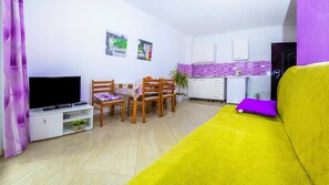Classic Apartment, Balcony | Living room | 82-cm flat-screen TV with satellite channels, TV