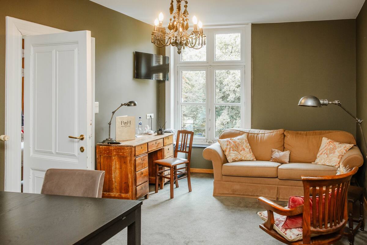 suite, park view, garden area | living area | flat-screen tv