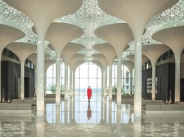 A spacious interior with high ceilings and a central open area.