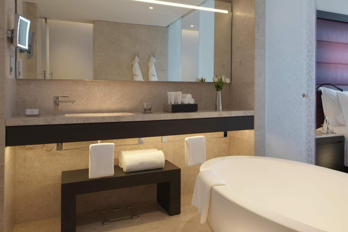 Combined shower/bathtub, deep-soaking bathtub, designer toiletries