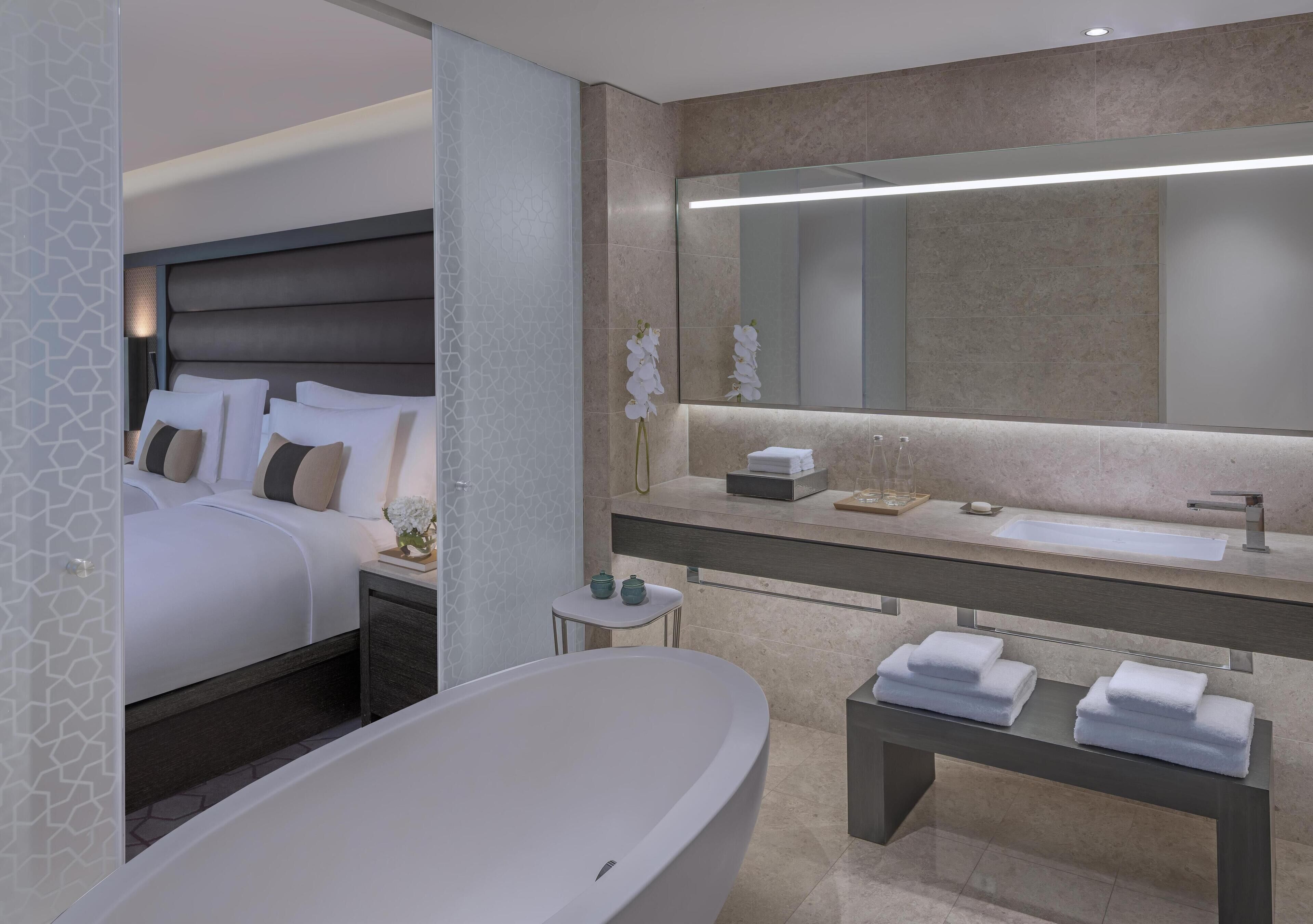 Combined shower/tub, deep soaking tub, designer toiletries, hair dryer