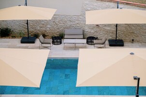 Outdoor pool, open 7:30 AM to 8:30 PM, pool loungers