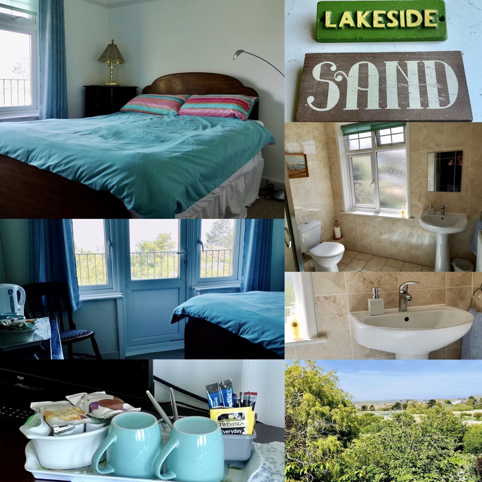 A bedroom with a bed, a bedside table with a lamp, a window with curtains, and a view of greenery outside.