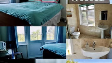 A bedroom with a bed, a bedside table with a lamp, a window with curtains, and a view of greenery outside.