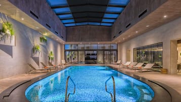 Indoor pool, open 6:00 AM to 10:00 PM, pool loungers
